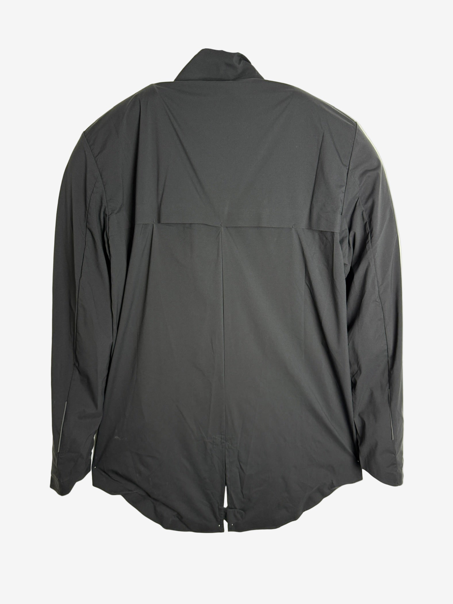 Dark gray jacket on a hanger against a light beige background