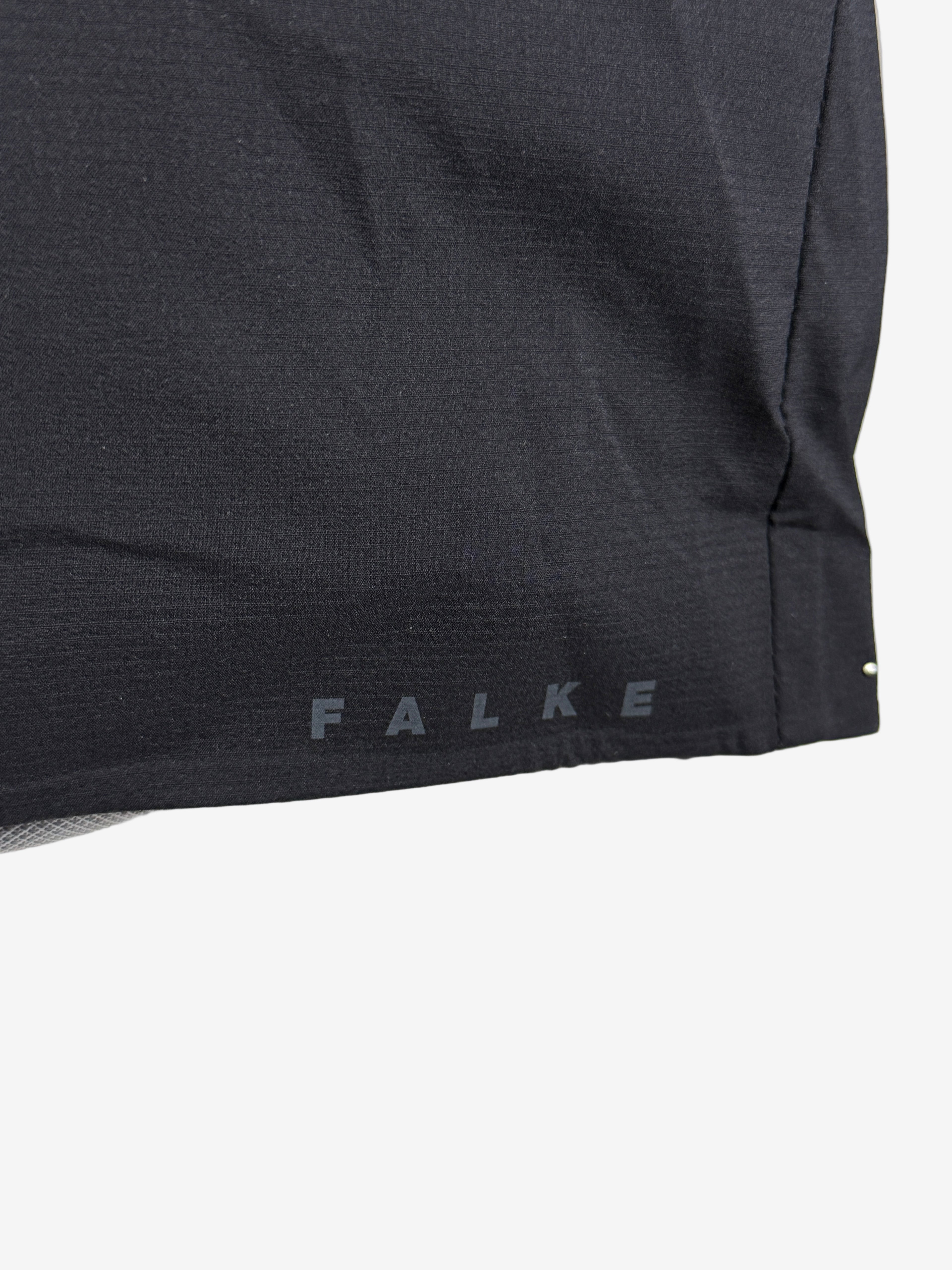 Black sock with 'FALKE' branding on a white background