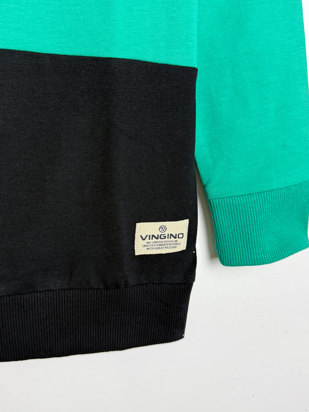 Green and black fabric with a Vingino label on a white background