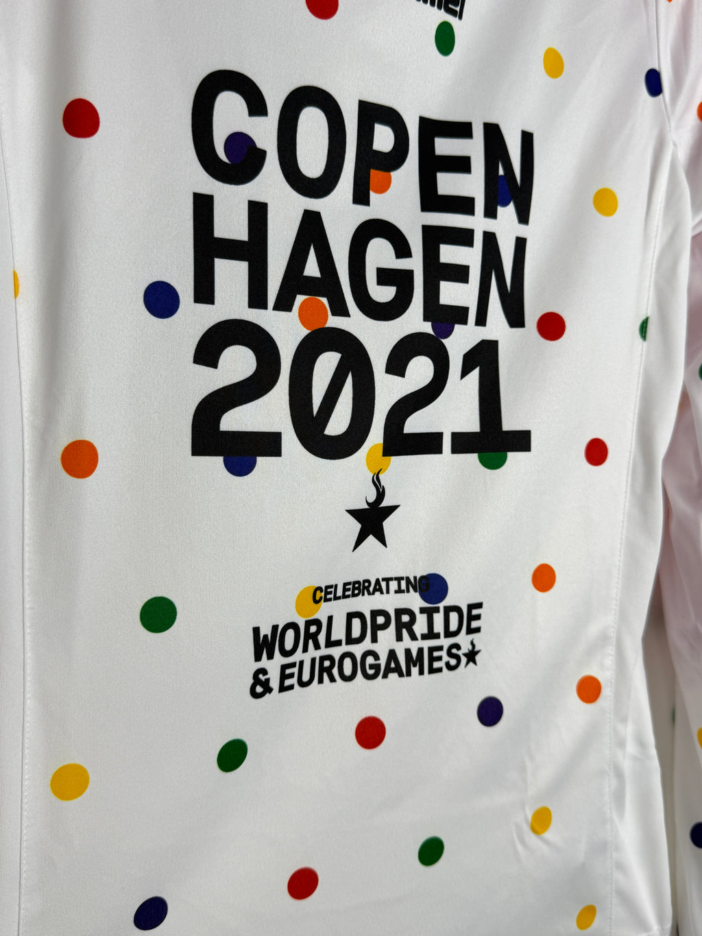 White pillowcase with colorful polka dots and text about Copenhagen 2021 and WorldPride Eurogames.