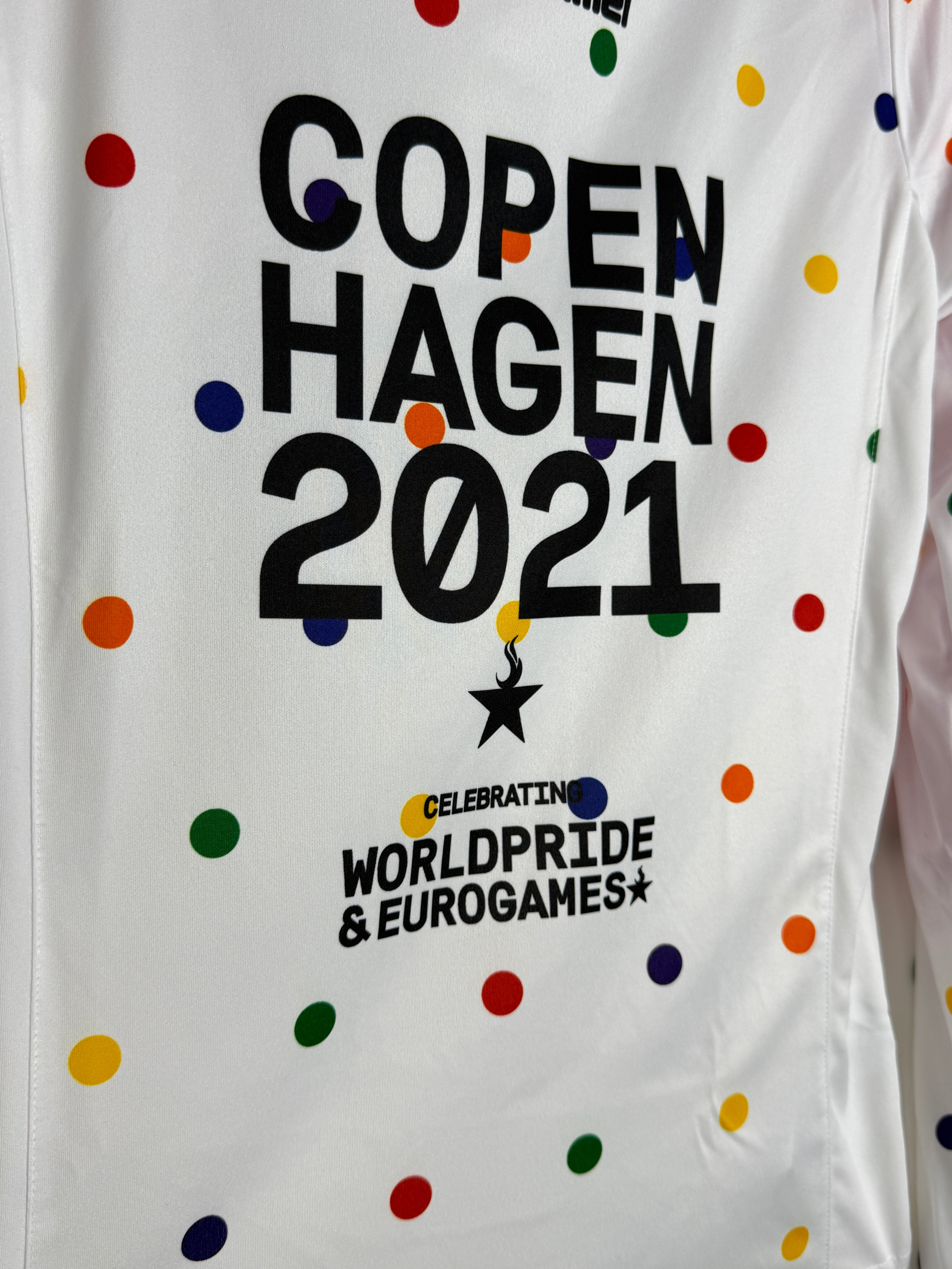 White pillowcase with colorful polka dots and text about Copenhagen 2021 and WorldPride Eurogames.