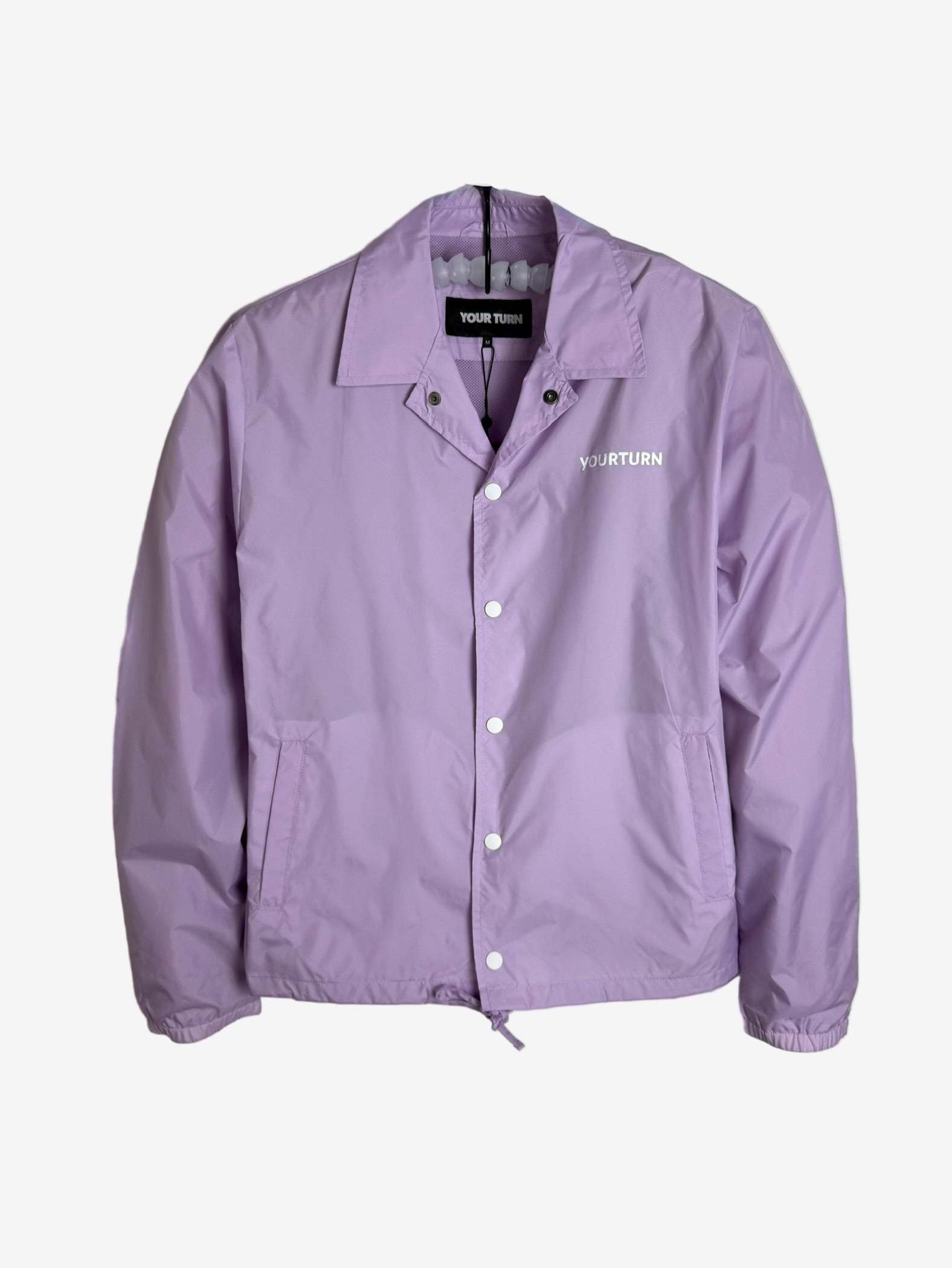 Purple jacket with a brand logo on a gray background