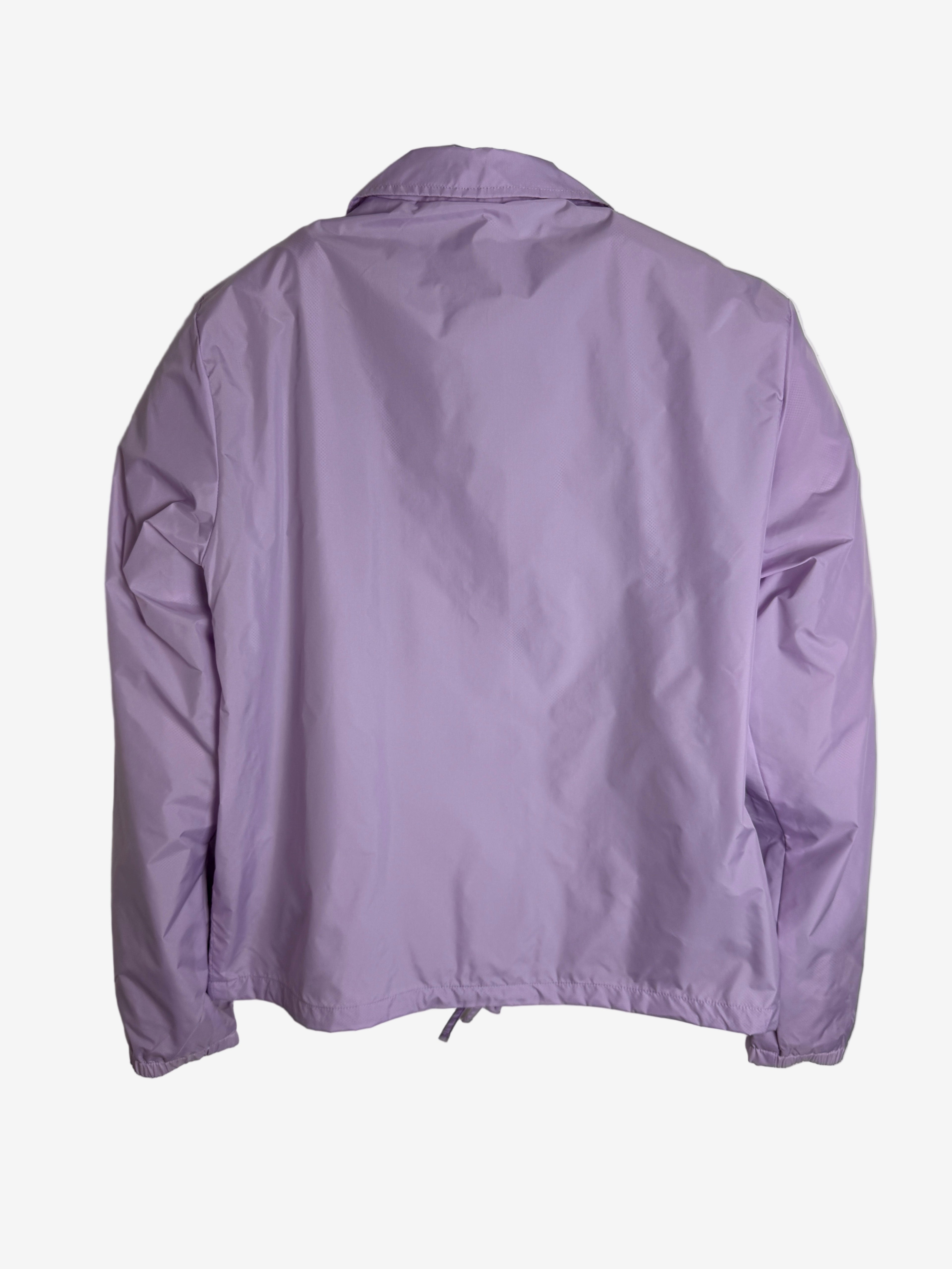 Purple jacket on a light gray background